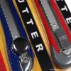 Yellow packaging utility knife with blue and red handle small shaving blade Application Scenario
